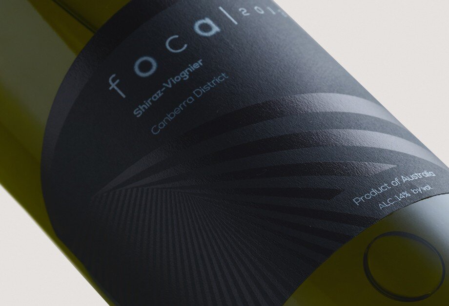 Closeup of black label wine bottle design 
